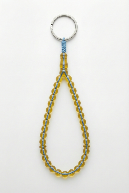 سلسلة مفاتيح من العنبر - ممتدة + شاهد وفواصل (31 خرزة)