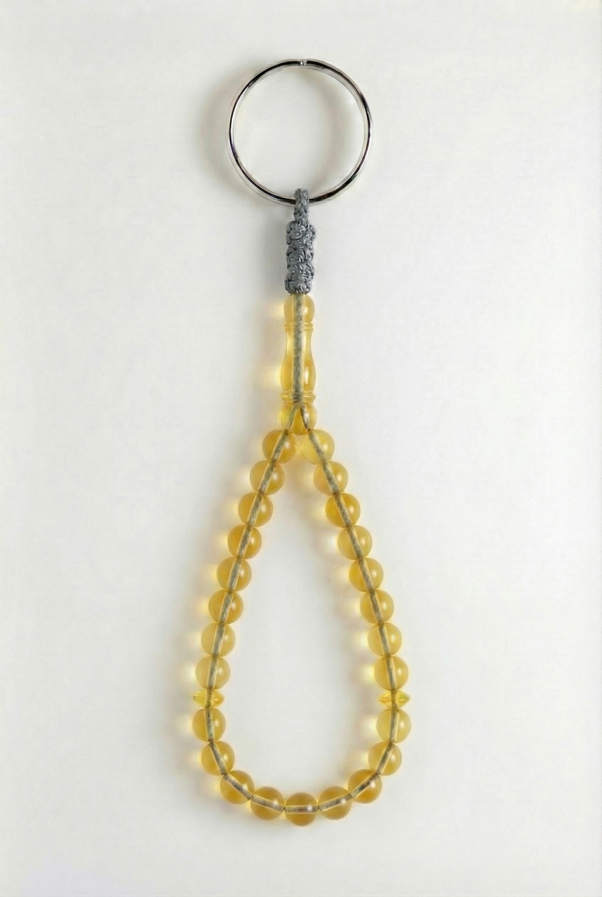 سلسلة مفاتيح من العنبر - سيقنتشر + شاهد وفواصل (25 خرزة)