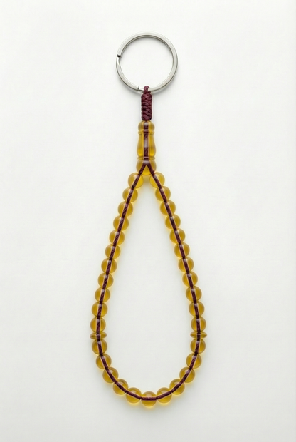 سلسلة مفاتيح من العنبر - ممتدة + شاهد وفواصل (31 خرزة)