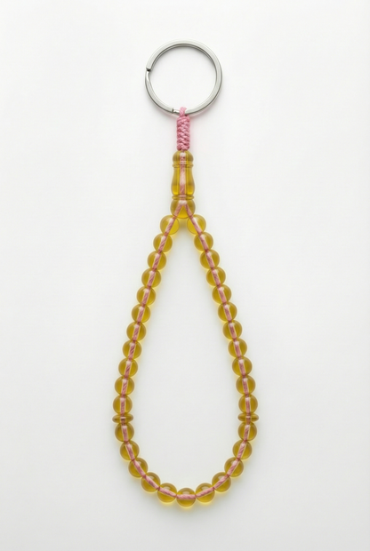 سلسلة مفاتيح من العنبر - ممتدة + شاهد وفواصل (31 خرزة)