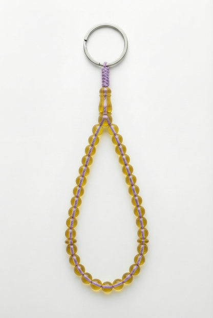 سلسلة مفاتيح من العنبر - ممتدة + شاهد وفواصل (31 خرزة)